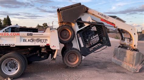 loading a skid steer without ramps|bobcat skid steer loading.